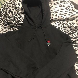 Black Hoodie with Skeleton Hand Holding a Rose